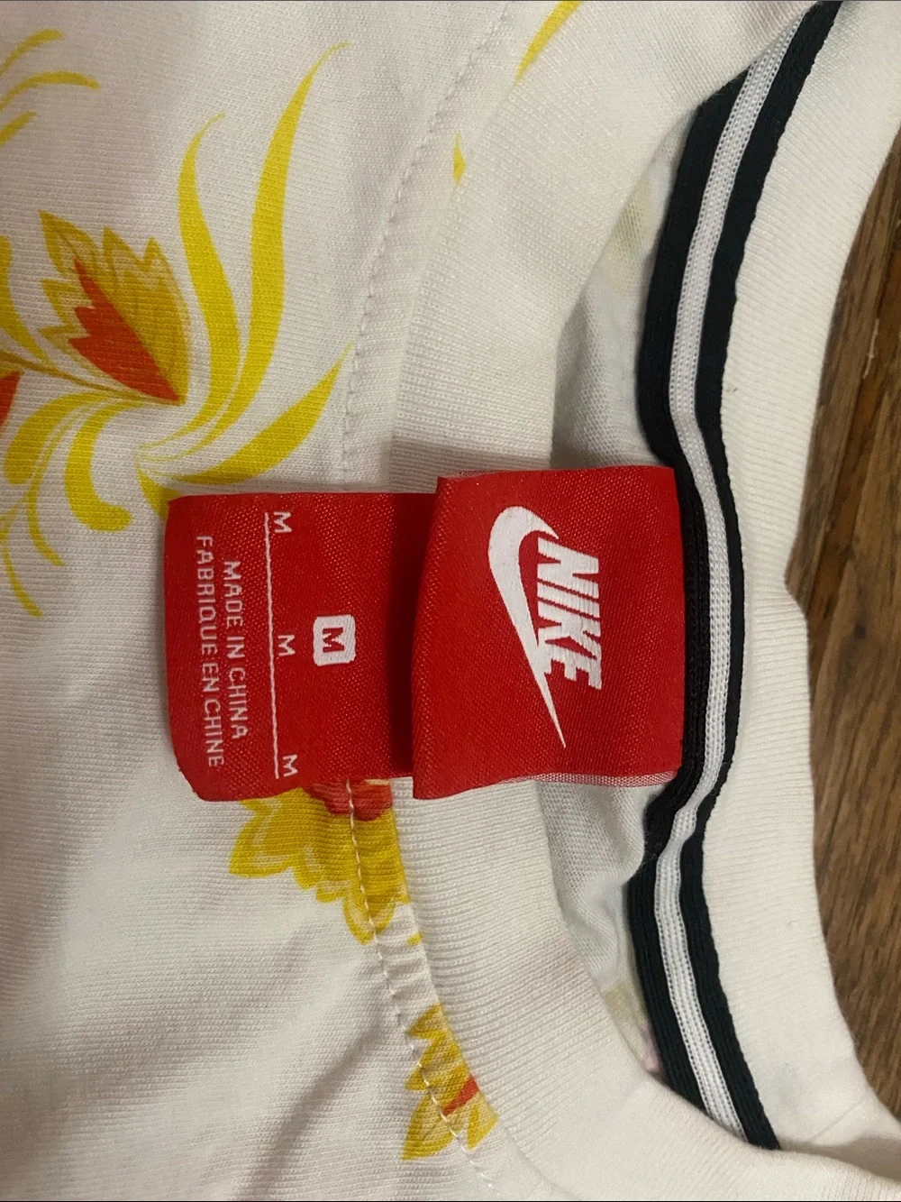 Nike White Tee with Red Logo and Yellow Floral Print